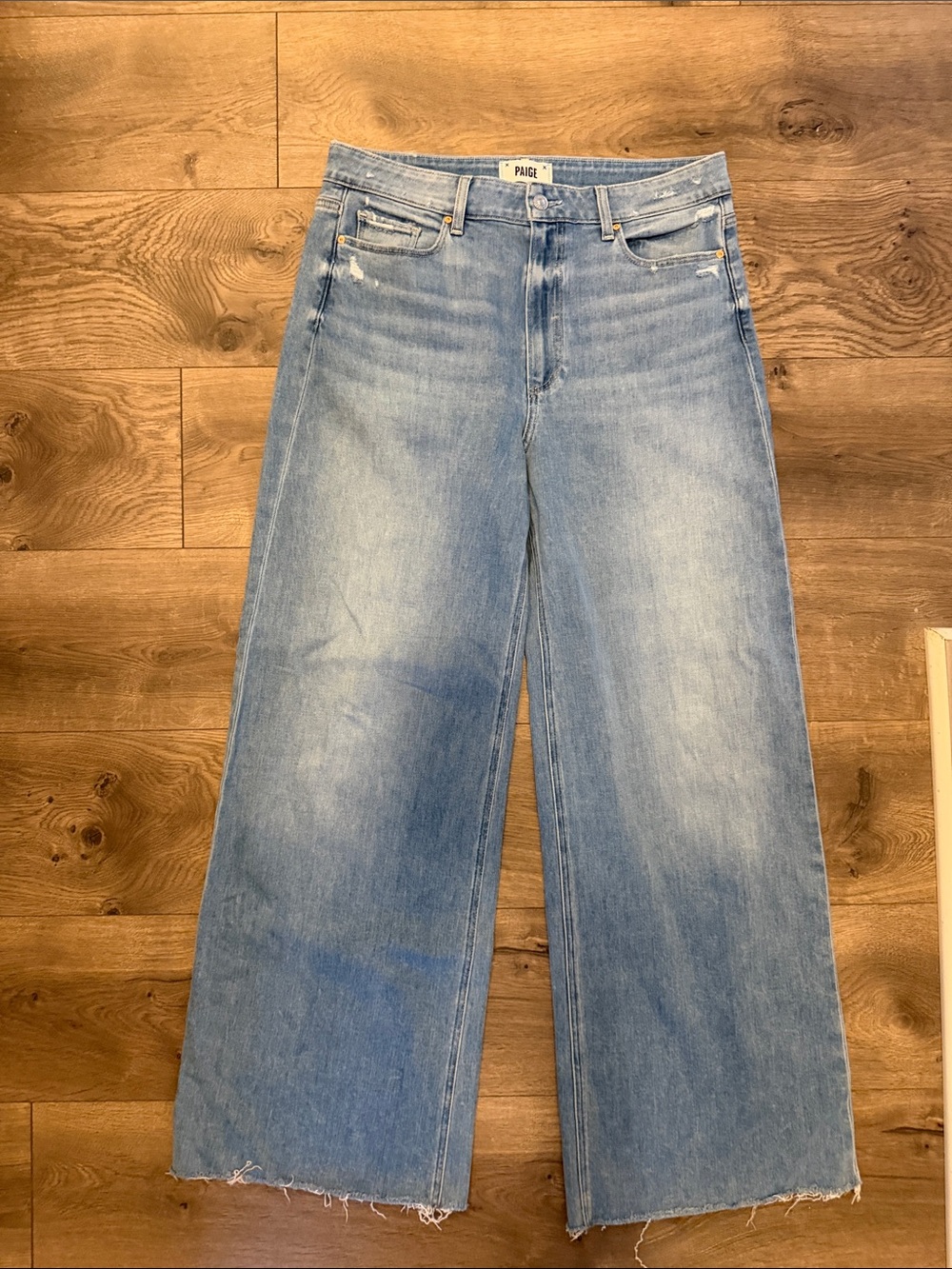 PAIGE Anessa Light Wash Wide-Leg Jeans with Raw Hem